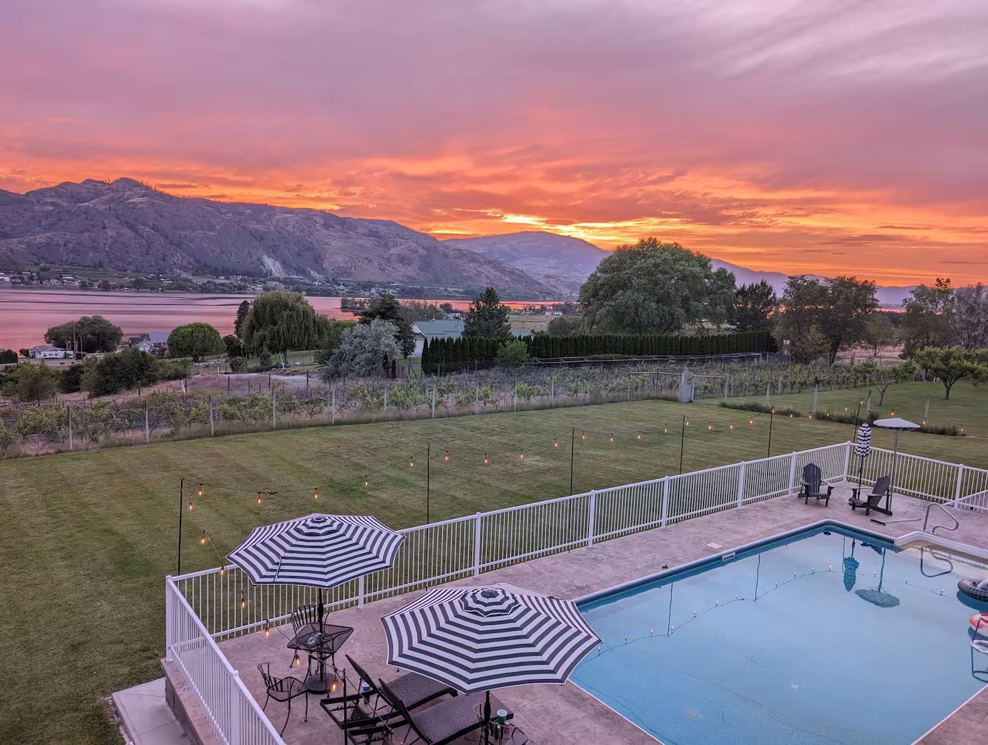 Sunset over Lake Osoyoos, the vineyard and pool below